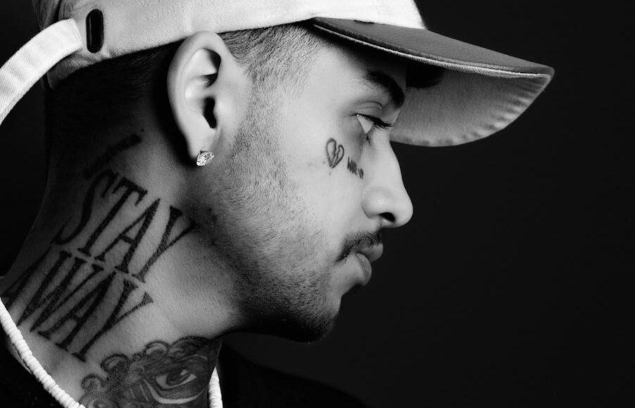 Zayn Malik almost hit in the head as water bottles are hurled at him at London event